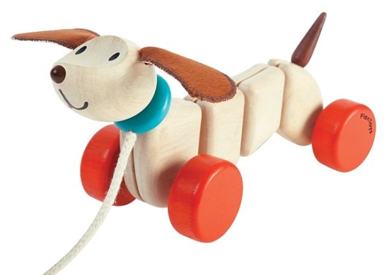 Glada valpen - dragleksak av trä från Plantoys