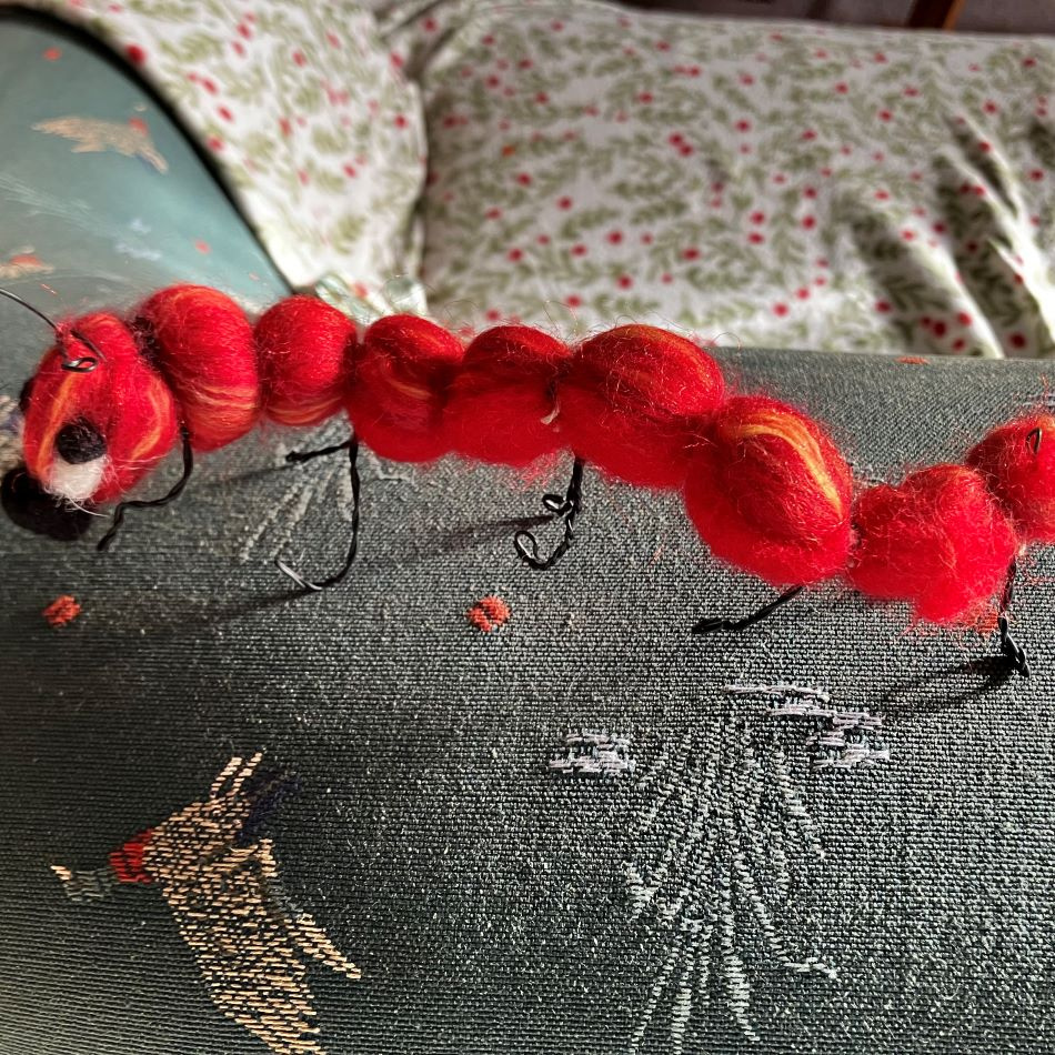 Ulldekoration-röd insekt